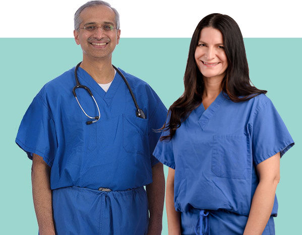 a man and a woman wearing blue scrubs are standing next to each other